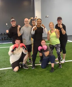 Jonathan, center, celebrated the effort I and the rest of the small group put in at one of his boxing-inspired workouts.