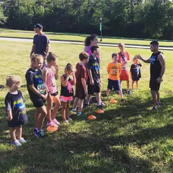 RipXFit owner Jean-Pierre leads a group of kids in a junior-sized Spartan-style workout.